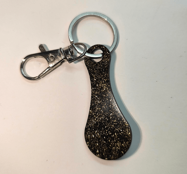 Jeton de caddie noir et doré 