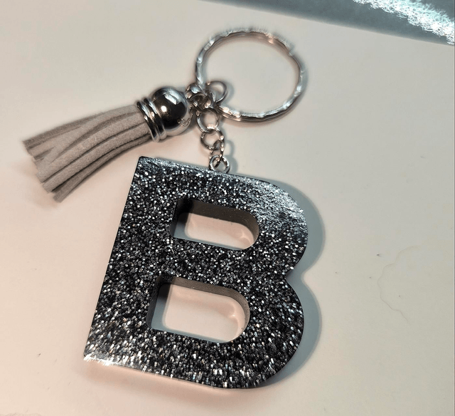 Porte clés initiale "B" noir pailleté 