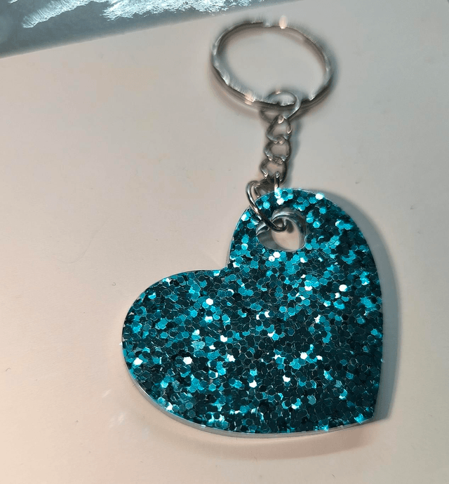 Porte clés coeur bleu turquoise pailleté 
