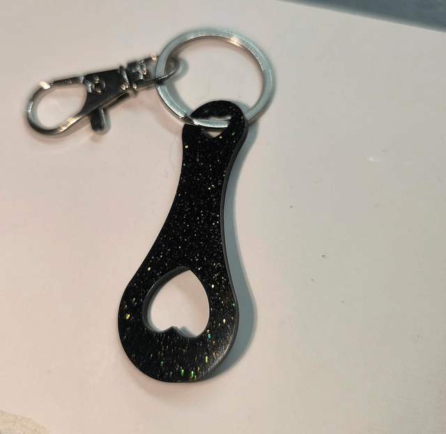 Jeton de caddie noir à paillettes vertes 