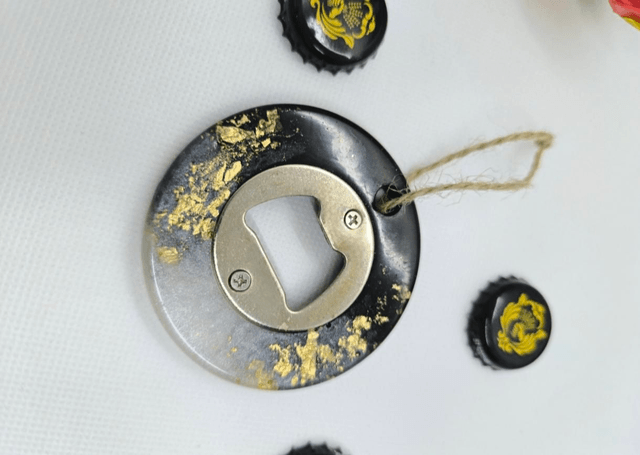 Décapsuleur rond noir et blanc nacré