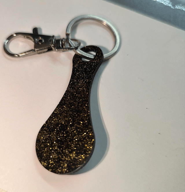 Jeton de caddie noir et doré 
