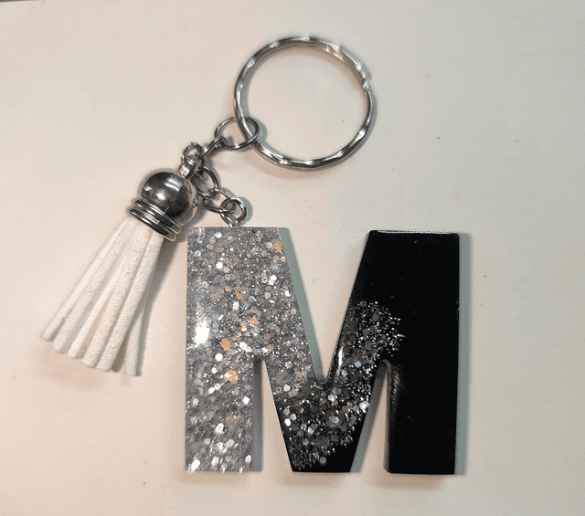 Porte clés initiale &quot;M&quot; noir paillettes argentées 